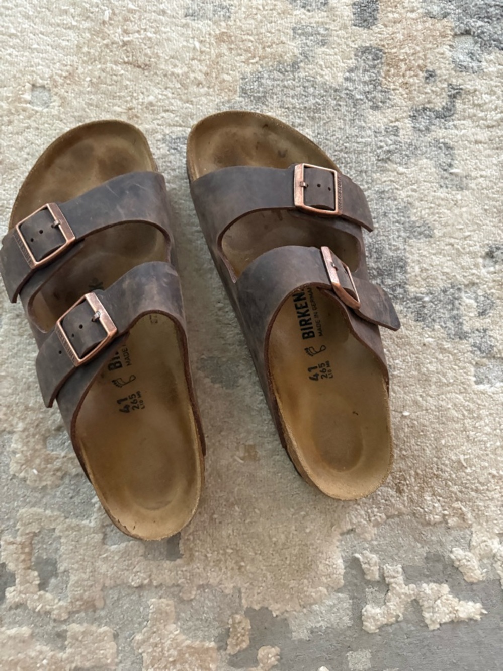 Birkenstock Arizona Two-Strap Sandals in Dark Brown with Copper Buckles
